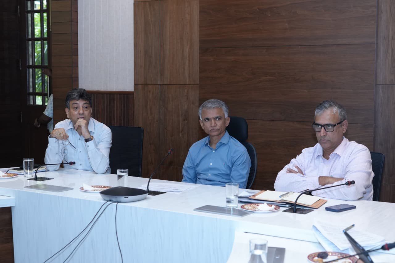 Greater Bengaluru Development Minister Krishna Byre Gowda (centre) attends a review meeting with senior officials ahead of the "Freedom from Waste" campaign. Maheshwar Rao is seated to his left, while Tushar Girinath is seated to his right. The officials are seated around a conference table in a meeting hall during a discussion with senior Greater Bengaluru Authority (GBA) officials.